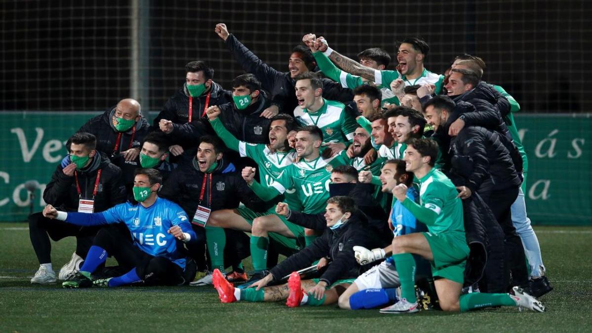 Cornella players celebrate after beating Atletico Madrid